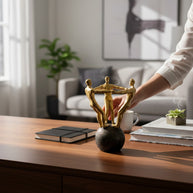 Man on Globe with Arms Out Sculpture – Gold
